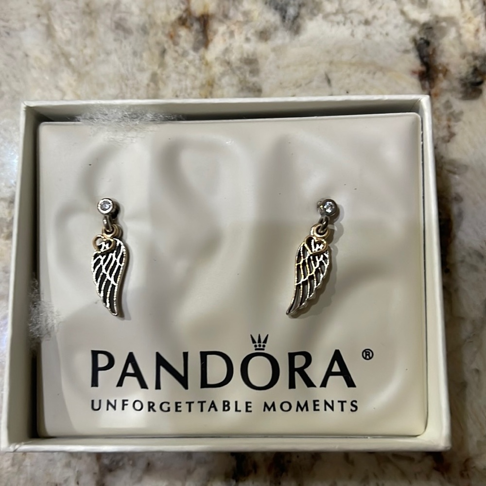 Brand new in box Pandora Angel Wing earrings.
